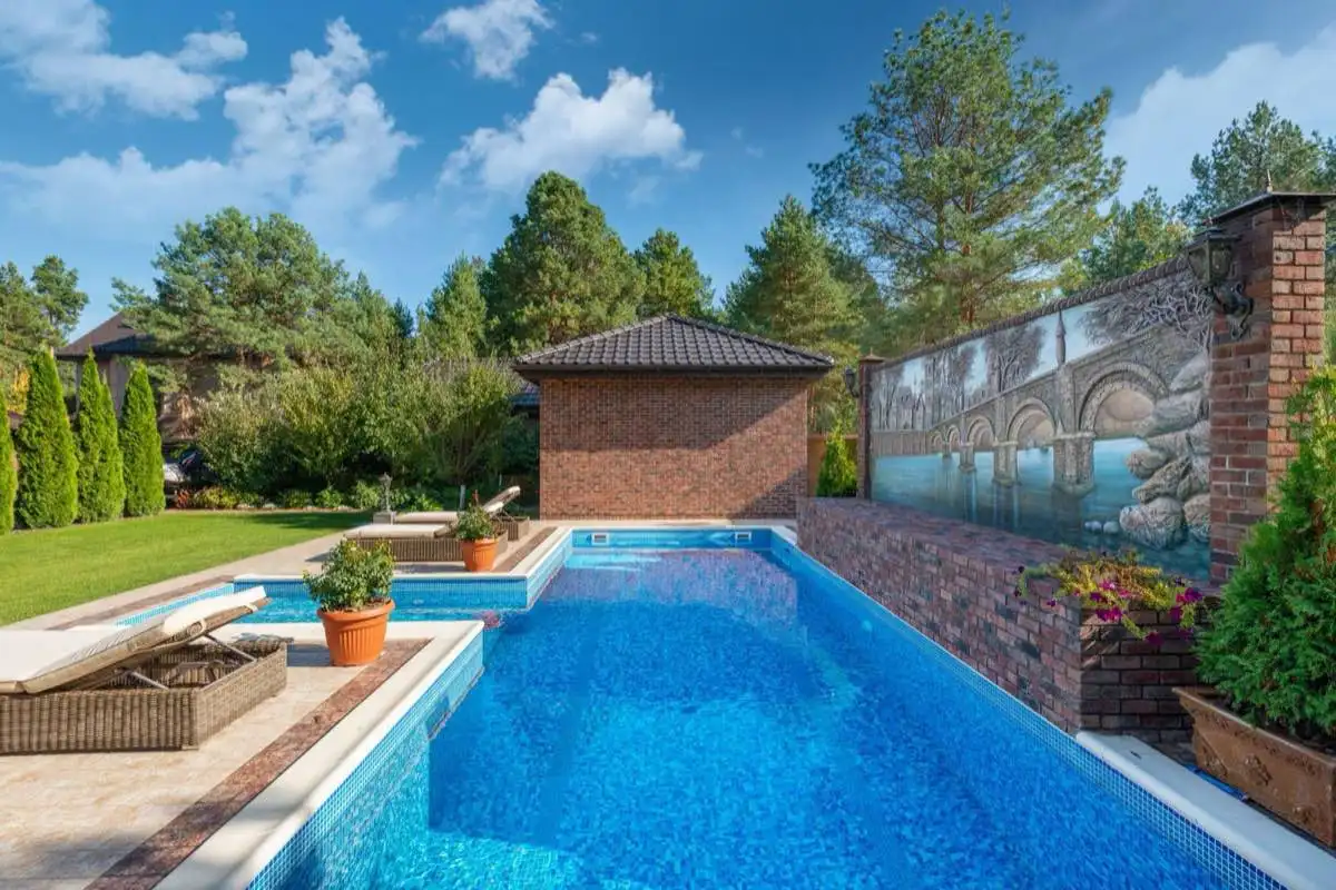 Backyard saltwater swimming pool in Port St. Lucie, FL on a clear day
